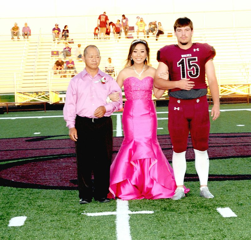 Photo courtesy of LifeTouch National Studios/Lincoln senior maid, Gao Lee, daughter of Ning-ma Lee and Neng fang Lee, escorted by her father and senior, Caleb Lloyd, son of Jerry and Angie Lloyd.