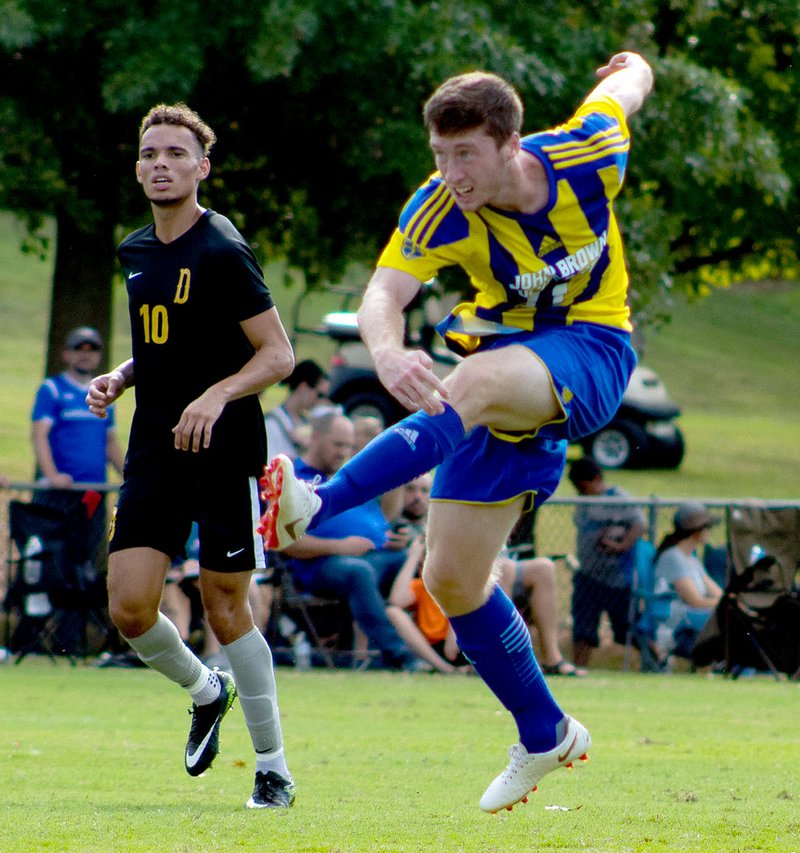Photo courtesy of JBU Sports Information John Brown senior forward Conner Haney takes a shot during Saturday's match against Science and Arts (Okla.).