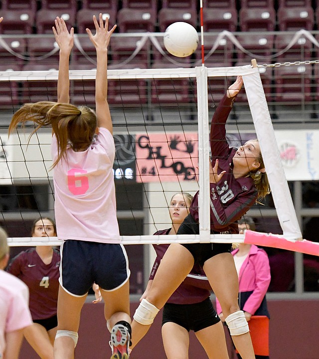 Bud Sullins/Special to the Herald-Leader Siloam Springs senior Katie Kendrick goes up for a hit as Shiloh Christian's Kaylee Jackson tries to block during Monday's volleyball match inside the Panther Activity Center.