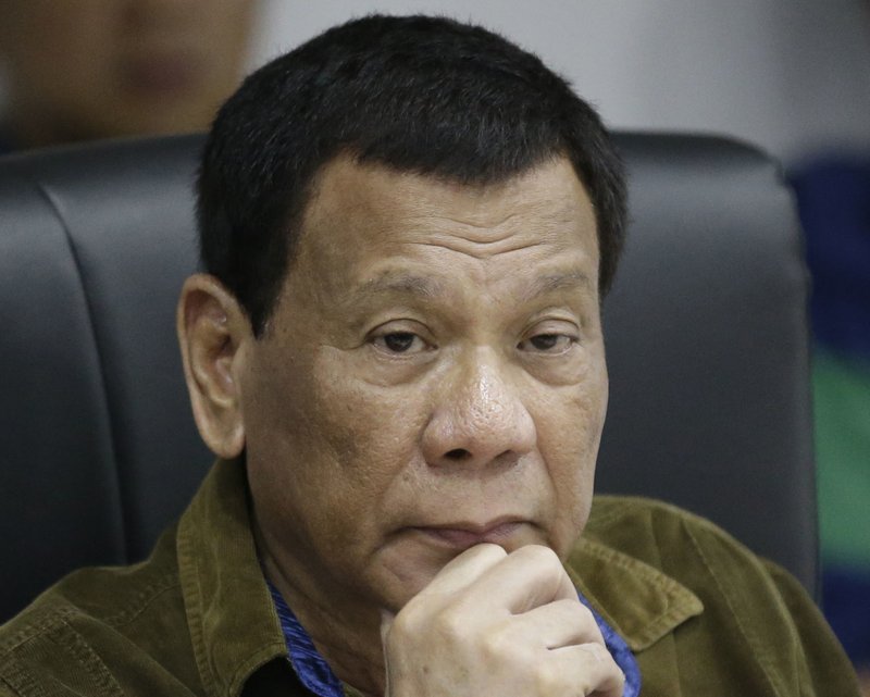 In this Sept. 13, 2018, file photo, Philippine President Rodrigo Duterte listens during a command conference on Typhoon Mangkhut, locally named Typhoon Ompong, at the National Disaster Risk Reduction and Management Council operations center in metropolitan Manila, Philippines. (AP Photo/Aaron Favila, File)