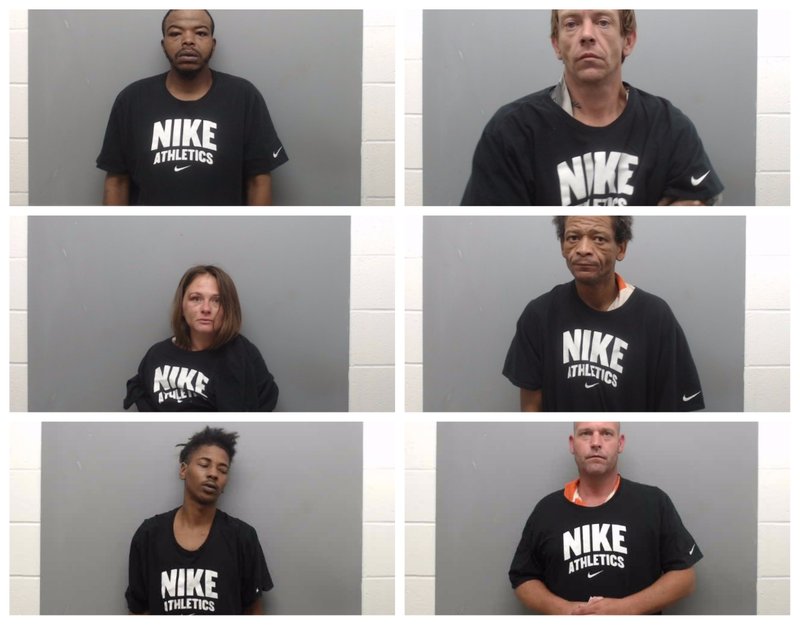 The Union County sheriff's office website's jail roster showed these six inmates and five others wearing the same Nike shirt before the images were removed on Wednesday night.