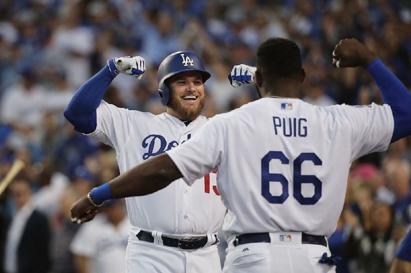 Max Muncy (left) was a non-roster invitee to spring training, but he hit 35 home runs in the regular season and helped lead the Los Angeles Dodgers to the National League Championship Series. 