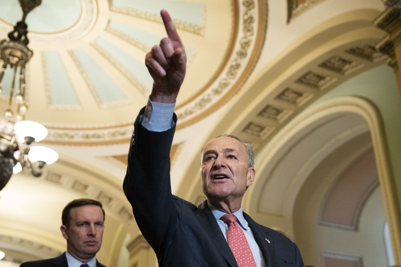 Senate Minority Leader Chuck Schumer of N.Y., points to a reporter as he speaks to media after the Democratic policy luncheon on Capitol Hill, Wednesday, Oct. 10, 2018, in Washington. Senate Democrats briefly turned the chamber's subject to health care Wednesday, just four days after lawmakers' nasty war over confirming Supreme Court Justice Brett Kavanaugh. (AP Photo/Alex Brandon)