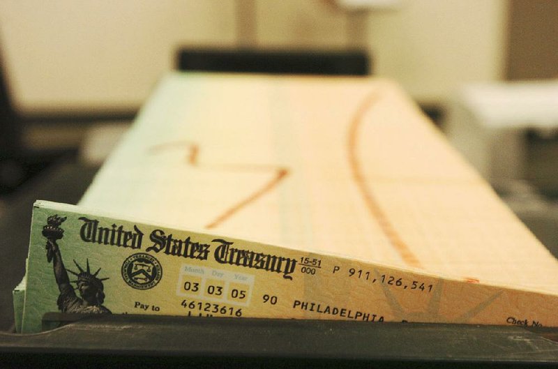 Trays of Social Security checks wait to be mailed from a U.S. Treasury facility in Philadelphia in this file photo. Social Security recipients will get a 2.8 percent increase in benefits in 2019, an average of $39 a month.