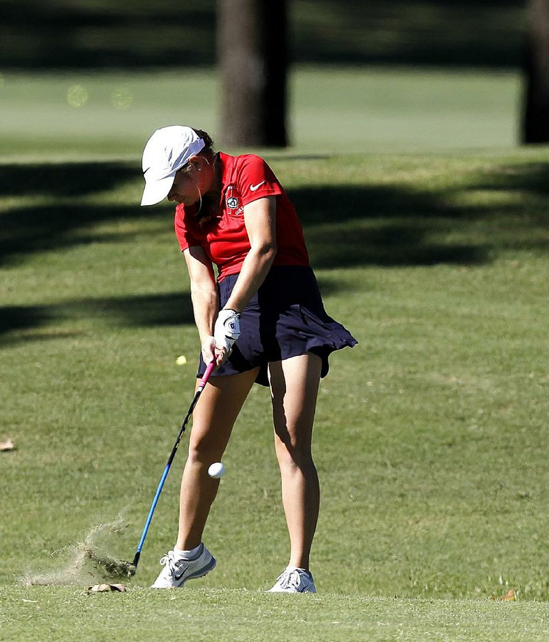 Baptist Prep’s Bailey Dunstan putts on the 17th hole during the girls Overall championship Thursday at Pleasant Valley Country Club in Little Rock. Dunstan won in a playoff over Lilly Thomas of Bentonville after shooting a 4-over 76. More photos are available at arkansasonline.com/galleries.