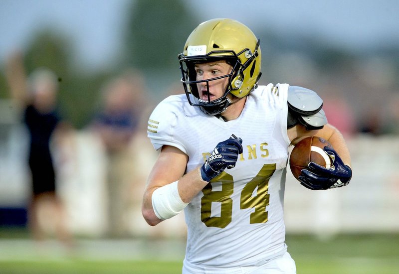 NWA Democrat-Gazette/Ben Goff HENRY TO THE HILL: Pulaski Academy tight end Hudson Henry runs for extra yards on Aug. 24 during the Bruins' 50-14 defeat of Class 7A Springdale Har-Ber at Wildcat Stadium in Springdale.