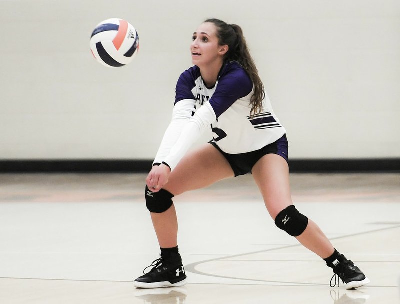 NWA Democrat-Gazette/CHARLIE KAIJO Fayetteville High School Claire Cooper (5) digs during a volleyball game, Thursday, October 11, 2018 at Rogers Heritage High School in Rogers.
