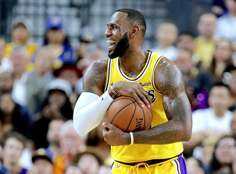 The Associated Press MATINEE SHOWTIME: Los Angeles Lakers forward LeBron James reacts after a play on Wednesday during a 123-113 preseason victory over the Golden State Warriors in Las Vegas.