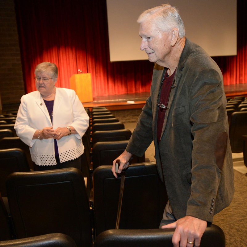 NWA Democrat-Gazette/ANDY SHUPE Pediatric dentist James Hunt (right) and longtime educator Faye Jones speak Thursday before the start of a presentation by the four Fayetteville Public Schools Hall of Honor inductees in the Performing Arts Center at Fayetteville High School. Also inducted were Peggy Taylor Lewis, who was one of the first black students to graduate from Fayetteville High School, and educator George Spencer.
