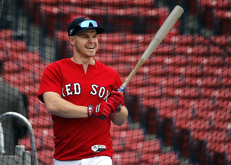 Boston Red Sox's Brock Holt holds a bat at a baseball workout, Thursday, Oct. 11, 2018, in Boston. 