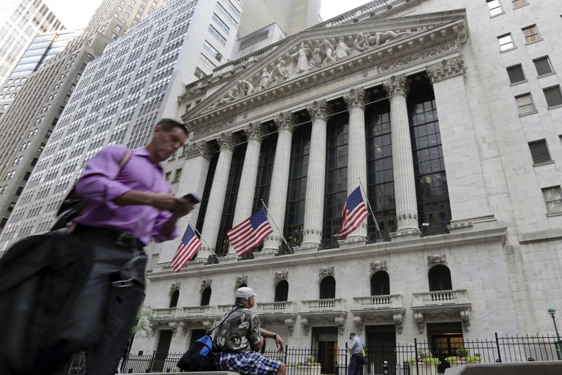 In this June 2016 file photo, a man walks by the New York Stock Exchange. Stocks rebounded Friday, clawing back some of the week's steep losses, but the turbulent trading of the last few days left no doubt that the relative calm the markets enjoyed all summer had been shattered. (AP Photo/Richard Drew, File)

