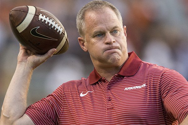 Arkansas athletics director Hunter Yurachek throws a football prior to a game between the Razorbacks and Auburn on Saturday, Sept. 22, 2018, in Auburn, Ala. 