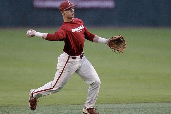 Arkansas shortstop Casey Martin throws out a UALR baserunner during the Razorbacks baseball scrimmage against UALR on Friday, Oct. 12, 2018, at Gary Hogan Field in Little Rock.