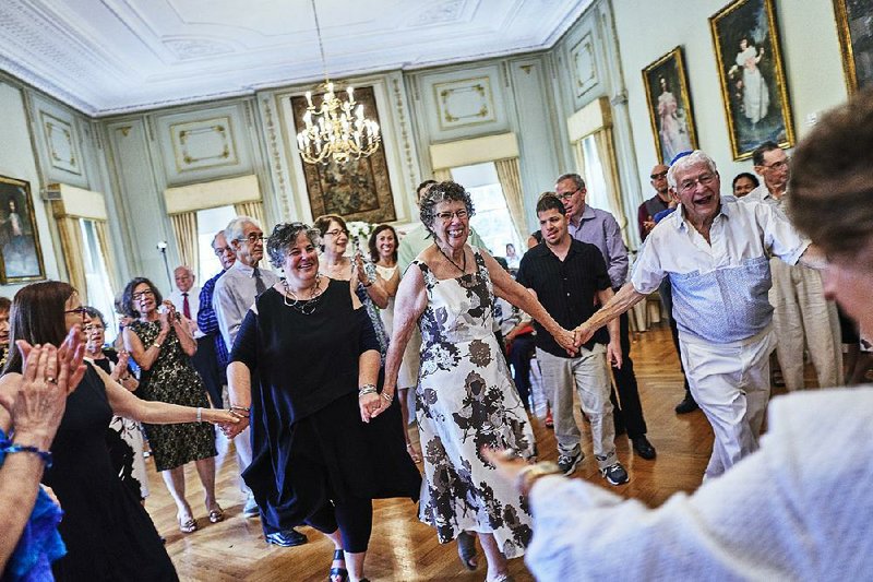 Guests dance with Elaine Hoffman (center, right) and Neil Ullman (right) at the couple’s wedding at Fairleigh Dickinson University in Madison, N.J., on Aug. 19.