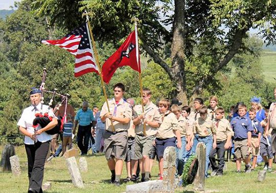 Submitted photo DEDICATION: Bagpiper Cindy Chiodini and Boy Scouts Troop No. 60 led the procession to the site. Photo is courtesy of the Marshall Mountain Wave and Horton descendant and photographer, Charity Rolen.