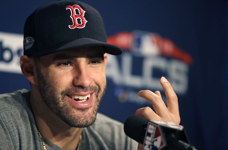 Boston Red Sox right fielder J.D. Martinez gestures as he is interviewed prior to a workout at Fenway Park, Friday, Oct. 12, 2018, in Boston. The Red Sox face the Houston Astros in baseball's American League Championship. (AP Photo/Charles Krupa)
