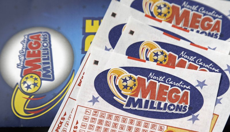 FILE - In this July 1, 2016, file photo, Mega Millions lottery tickets rest on a counter at a Pilot travel center near Burlington, N.C.  (AP Photo/Gerry Broome, File)

