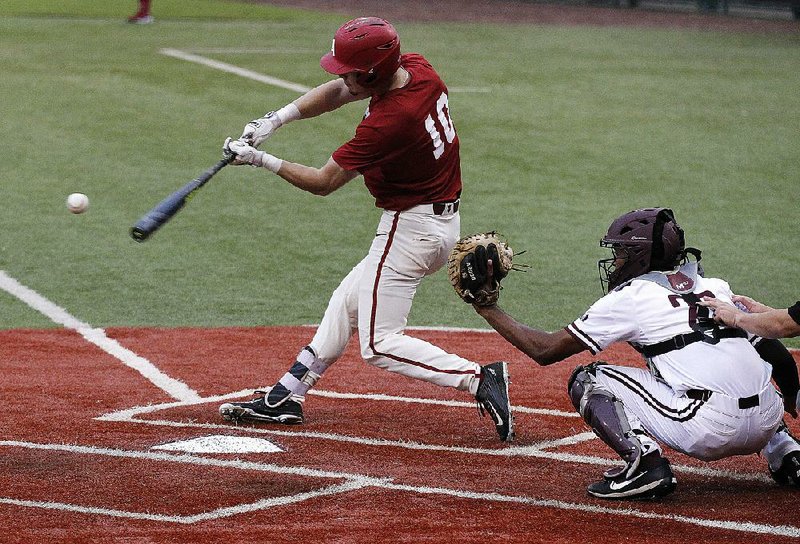 Easton Murrell gets a hit for the Arkansas Razorbacks in what is believed to be the first baseball game ever between the Razor- backs and the University of Arkansas at Little Rock — regular season or exhibition. 