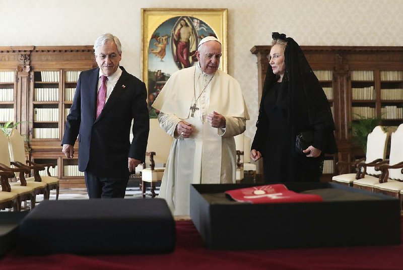 Pope Francis meets with Chilean President Sebastian Pinera (left) and his wife, Cecilia Morel, at the Vatican on Saturday for a discussion about the church’s abuse scandals.