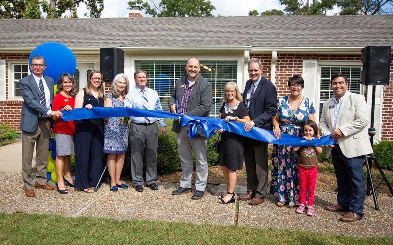 Photo submitted John Brown University opened the Alumni Welcome Center at a ribbon cutting ceremony on Saturday. The center will serve as a hospitality hub for visiting alumni and also houses the University Archives. Pictured, from left to right, are Jim Krall, April Moreton, Kathryn Cottrell, Stephania Brown, John E. Brown III, Brad Edwards, Carey Pollard, JBU President Chip Pollard, Marikit Schwartz Fain, Tala Fain and Rob Sorbo.