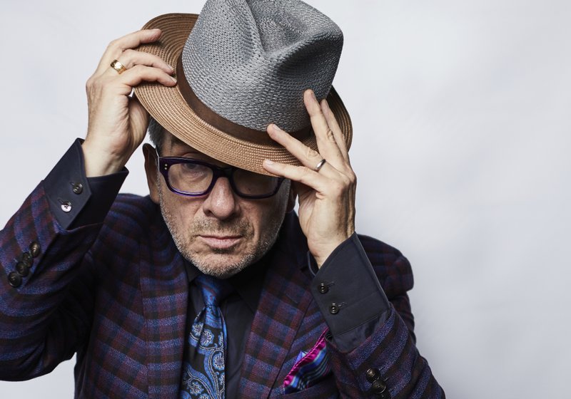 This Sept. 17, 2018 photo shows music legend Elvis Costello posing for a portrait at The Redbury New York hotel in New York to promote his latest release "Look Now." (Photo by Matt Licari/Invision/AP)