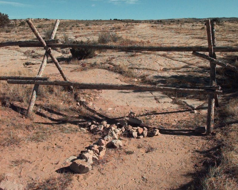 The Associated Press MEMORIAL: In this Oct. 9, 1999, file photo, a cross made of stones rests below the fence in Laramie, Wyo. where a year earlier, University of Wyoming student Matthew Shepard was tied and pistol whipped into a coma. He later died. The murder of Shepard was a watershed moment for gay rights and LGBTQ acceptance in the U.S., so much so that 20 years later the crime remains seared into the national consciousness. See related story on Page 6A.