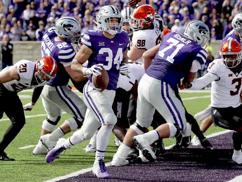 Kansas State running back Alex Barnes (34) scores a touchdown during the second half of an NCAA college football game against Oklahoma State in Manhattan, Kan., Saturday, Oct. 13, 2018. (AP Photo/Orlin Wagner)