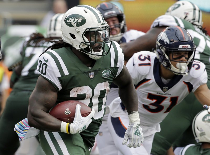 FILE - In this Sunday, Oct. 7, 2018, file photo, New York Jets' Isaiah Crowell (20) rushes against the Denver Broncos during the first half of an NFL football game in East Rutherford, N.J. Crowell had the game of a lifetime last Sunday, running for a New York Jets-record 219 yards. He was named the AFC's offensive player of the week, and Crowell is looking to build off his big performance. (AP Photo/Seth Wenig, File)