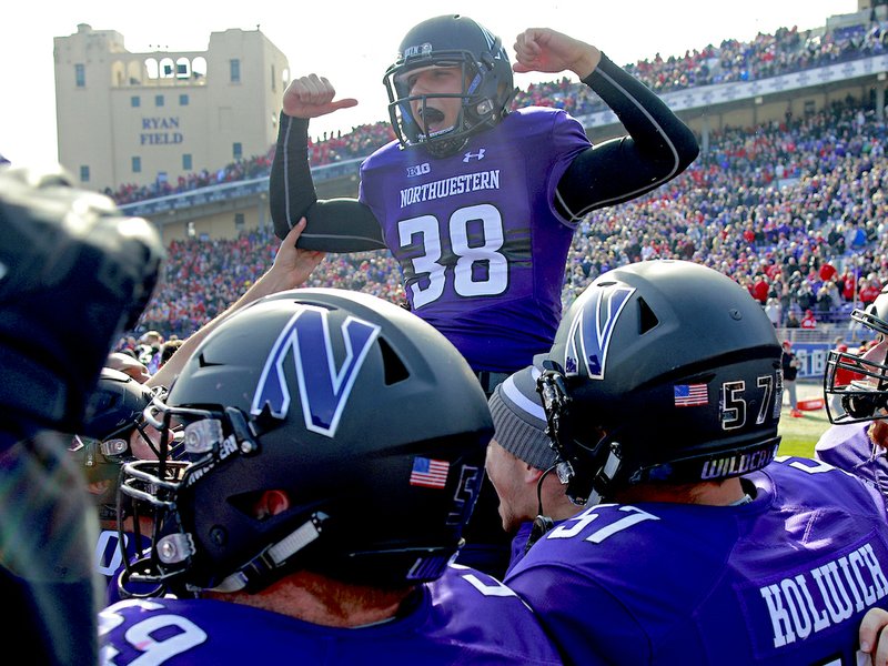 Northwestern's Drew Luckenbaugh (38) celebrates his game-winning field goal in overtime against Nebraska in an NCAA college football game Saturday, Oct. 13, 2018, in Evanston, Ill.. (AP Photo/Jim Young)