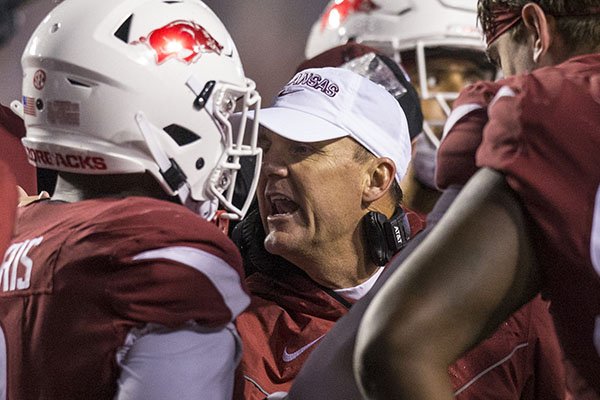 Arkansas coach Chad Morris talks to players during the third quarter of a game against Ole Miss on Saturday, Oct. 13, 2018, in Little Rock. 