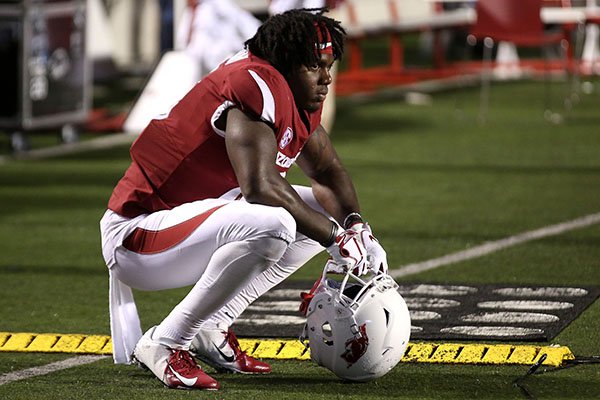 Arkansas wide receiver La'Michael Pettway (16) kneels on the sideline after the Razorbacks' 37-33 loss to Ole Miss on Saturday, Oct. 13, 2018, at War Memorial Stadium in Little Rock.