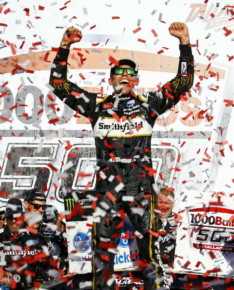 Aric Almirola celebrates after winning Sunday’s NASCAR Cup Series race in overtime at Talladega Supers peedway in Talladega, Ala.The victory snapped a 149-race losings treak for Almirola and earned him an automatic berth into the third round of the playoffs.
