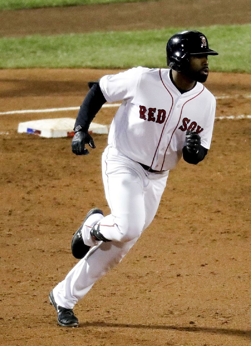 Jackie Bradley Jr. of the Boston Red Sox rounds first base after a three-run double during the third inning Sunday in Game 2 of the American League Championship Series against the Houston Astros in Boston. The Red Sox won 7-5 to even the series at 1-1.