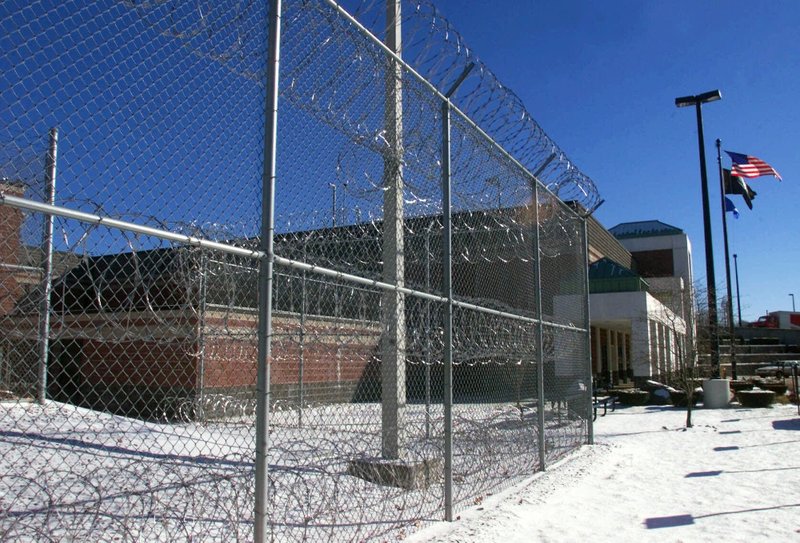 FILE - This Jan. 14, 2000, file photo shows the exterior of the Garner Correctional Institution in Newtown, Conn. Guards and inmates at the institution are on the same side of a legal fight against the state over radon. A ruling by federal judge last month will allow 13 inmates to move forward with a lawsuit that alleges the state confined them in inhumane conditions because of high levels of the radioactive gas. A group of 16 former guards and staff member sued in August. (Tom Kabelka/Republican-American via AP, File)