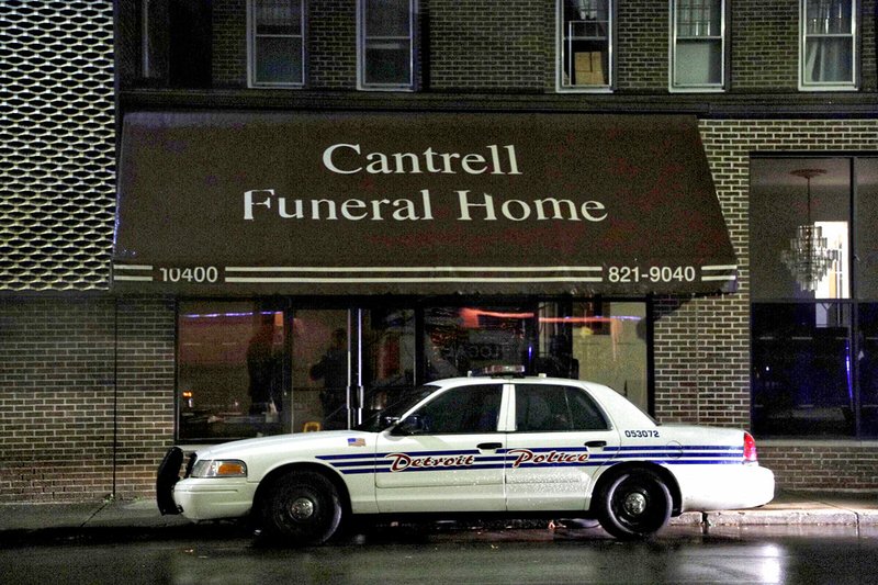 A Detroit police vehicle is parked outside the Cantrell Funeral Home in Detroit on Friday, Oct. 12, 2018.