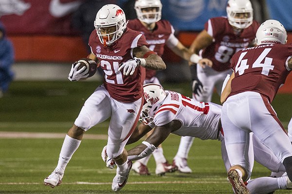 Arkansas running back Devwah Whaley (21) carries the ball during a game against Ole Miss on Saturday, Oct. 13, 2018, in Little Rock. 