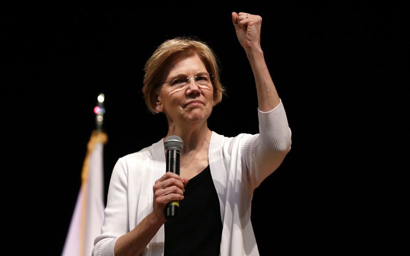 In this Aug. 8, 2018 file photo, U.S. Sen. Elizabeth Warren, D-Mass., gestures during a town hall style gathering in Woburn, Mass. She took the DNA test President Donald Trump urged. She's hitting back in personal terms, calling him "creepy" on Twitter, in real time. And she's not backing down. When it comes to challenging the man who redefined the rules of American political combat, Warren in some ways is doing it Trump's way. She's getting some backlash from Native Americans and grumbling from Democrats who'd rather be talking about toppling Congress' Republican majorities in the midterm elections three weeks away. (AP Photo/Charles Krupa, File )