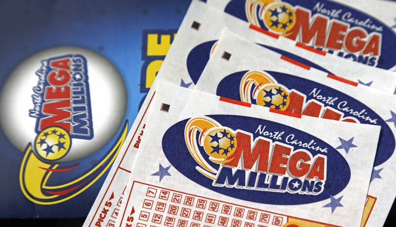 This July 1, 2016, file photo shows Mega Millions lottery tickets on a counter at a Pilot travel center near Burlington, N.C. After nearly three months without a winner, the Mega Millions lottery game has climbed to an estimated $654 million jackpot. Unfortunately, even as the big prize for its drawing Tuesday night, Oct. 16, 2018, increases to the fourth-largest in U.S. history , the odds of matching all six numbers and winning the game don't improve. They're stuck at a miserable one in 302.5 million. (AP Photo/Gerry Broome, File)