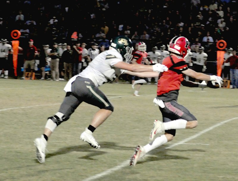 MARK HUMPHREY ENTERPRISE-LEADER Farmington junior Drew Sturgeon, shown catching a fourth-down conversion pass from quarterback Eric Hill against Alma, drew tight coverage at Vilonia while catching 6 passes for 84 yards. He kicked a 31-yard field goal during Farmington's 28-25 road loss Friday, Oct. 12, 2018.