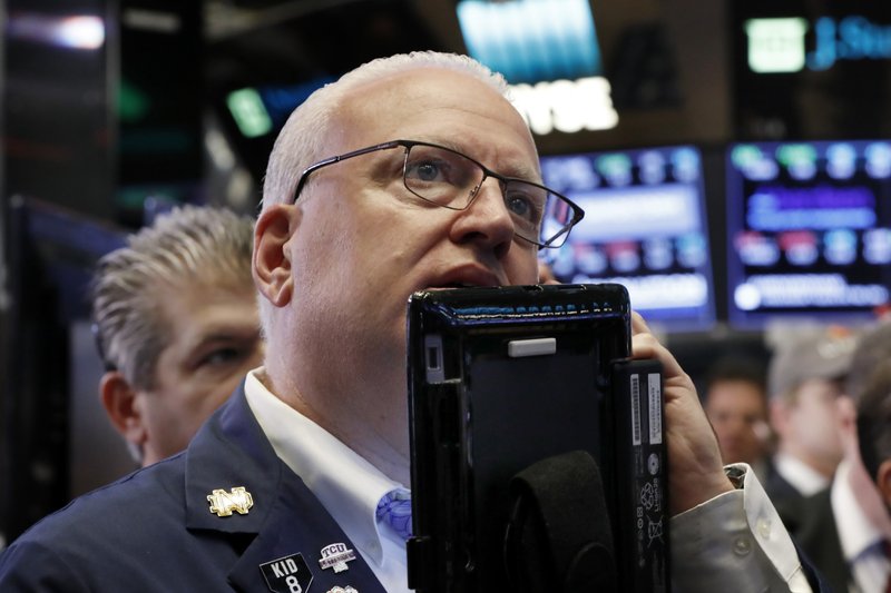 In this Oct. 11, 2018, file photo trader Thomas Ferrigno works on the floor of the New York Stock Exchange. The U.S. stock market opens at 9:30 a.m. EDT on Tuesday, Oct. 16. 