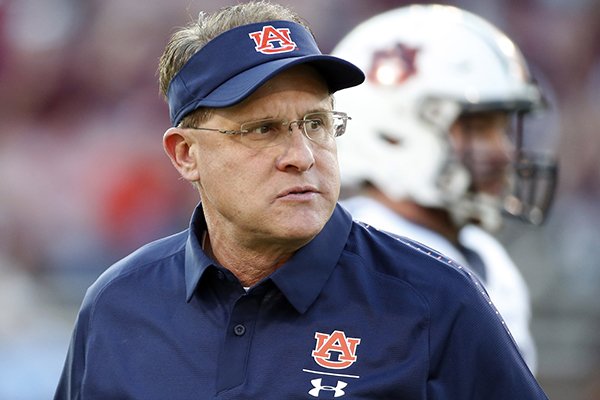 Auburn coach Gus Malzahn watches players warm up for an NCAA college football game against Mississippi State in Starkville, Miss., Saturday, Oct. 6, 2018. Mississippi State won 23-9. (AP Photo/Rogelio V. Solis)

