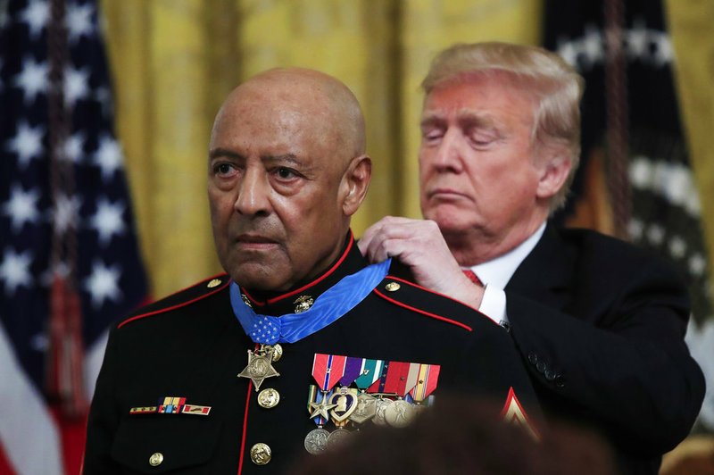 President Donald Trump presents the Medal of Honor to U.S. Marine Corps retired Sgt. Maj. John Canley during an East Room ceremony at the White House in Washington on Wednesday, Oct. 17, 2018. Canley is the 300th Marine to receive the nation's highest military medal. 