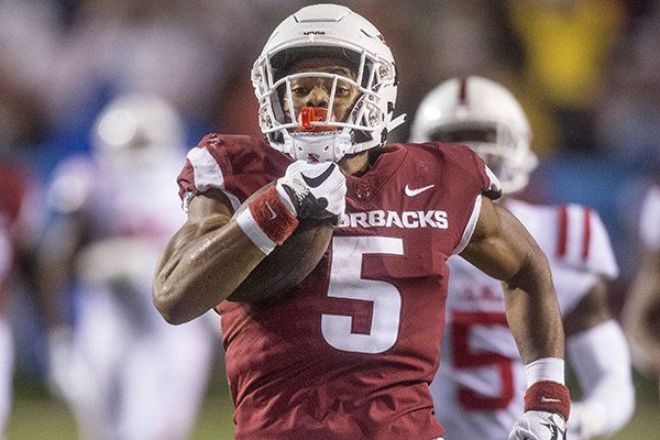 Arkansas running back Rakeem Boyd outruns the Ole Miss defense for a 69-yard touchdown during a game Saturday, Oct. 13, 2018, in Little Rock. 