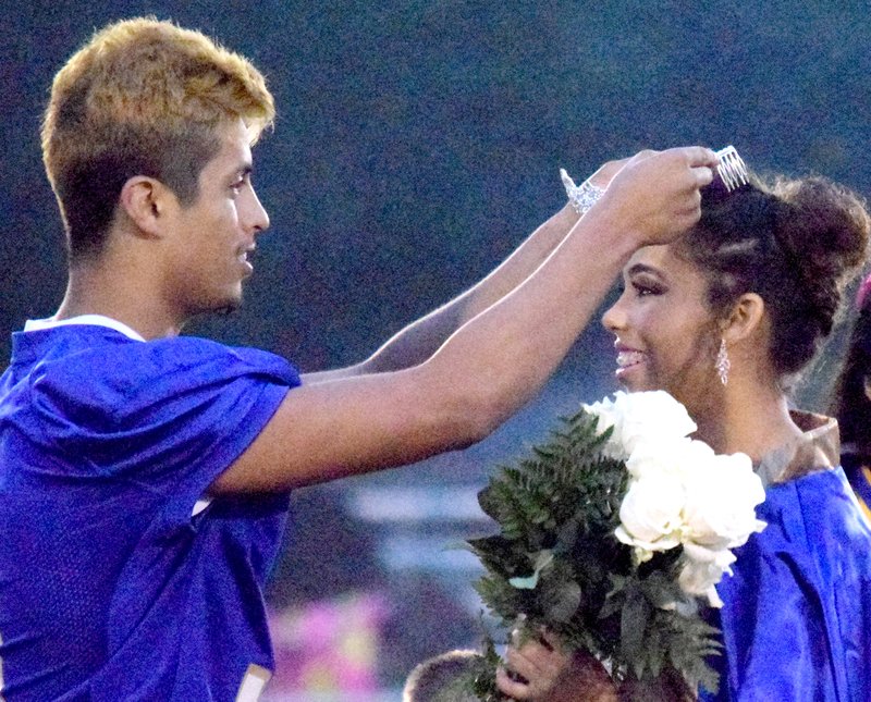 Homecoming king Jimmy Mendoza (left) crowns the 2018 Homecoming Queen Desi Meek during the coronation ceremony at Bulldog Stadium in Decatur Oct. 12.
