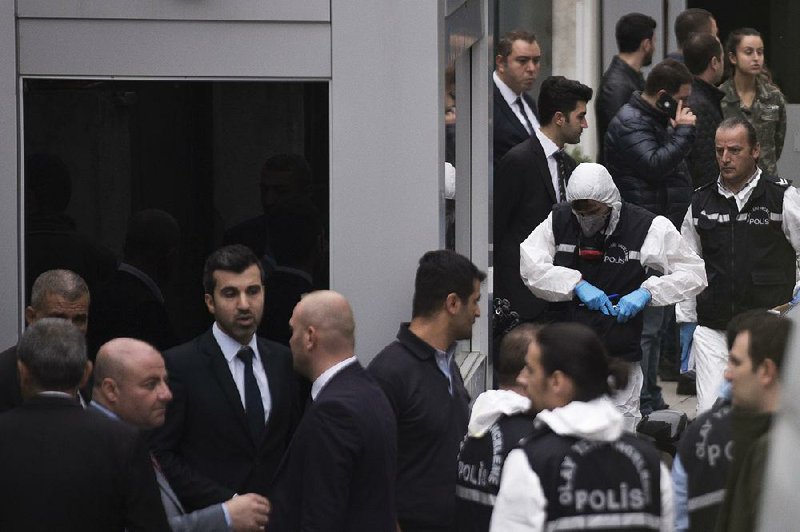 Turkish forensics officers prepare to enter the Saudi consul’s residence Wednesday in Istanbul. Turkey’s private DHA news agency said police wanted to inspect a “water well” in a garden at the residence. 