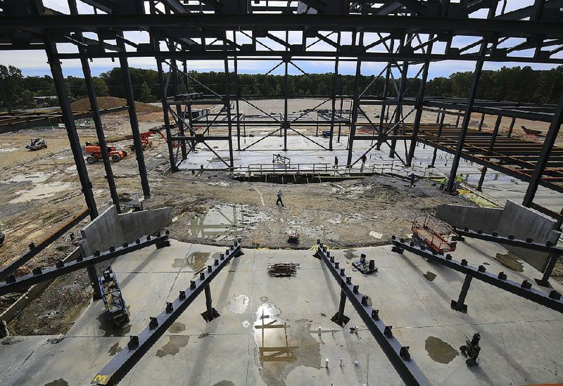 Construction continues Wednesday on the 1,200-seat auditorium at the new Little Rock Southwest High School after a topping out ceremony for the facility.