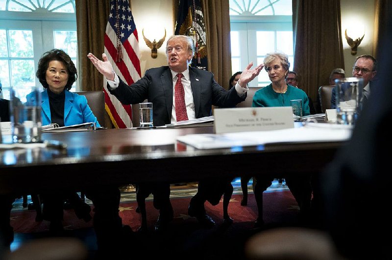 President Donald Trump calls Wednesday on Cabinet members, including Transportation Secretary Elaine Chao (left) and Linda McMahon, Small Business Administration administrator, to fi nd ways to cut their budgets by 5 percent. “Get rid of the fat, get rid of the waste,” Trump said. But he exempted the defense budget from cuts. 