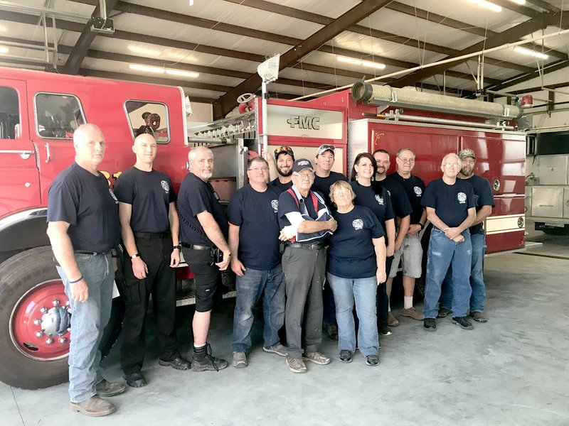 Photo by Sally Carroll/McDonald County Press The Goodman Area Fire Protection District recently moved into a new fire station on East Russell Street in Goodman. Firefighters have rebounded after a tornado last year destroyed their main facilities. The team includes Fire Chief Keith Estes and firefighters Jared Mackall, Harvey Mayhan, David Todd, Clay Sexson, Bud Richmond, Justin Sellers, Diana Richmond, Ashley Carter, Kevin Carter, Keith Holloway, Bud Gilmore and Kent Hartman.