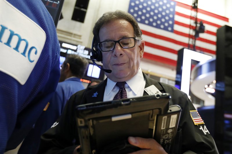 In this Oct. 2, 2018, file photo trader Sal Suarino works on the floor of the New York Stock Exchange. The U.S. stock market opens at 9:30 a.m. EDT on Wednesday, Oct. 17. (AP Photo/Richard Drew, File)