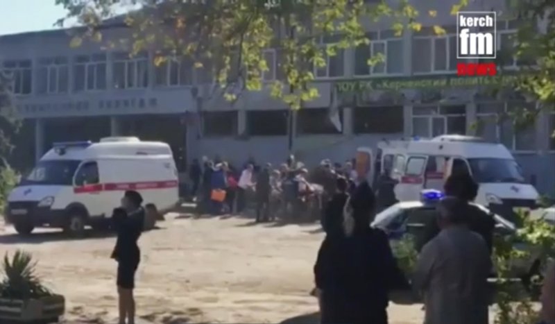 In this image made from video, showing the scene as emergency services load an injured person onto a truck, in Kerch, Crimea, Wednesday Oct. 17, 2018.  (Kerch FM News via AP) 